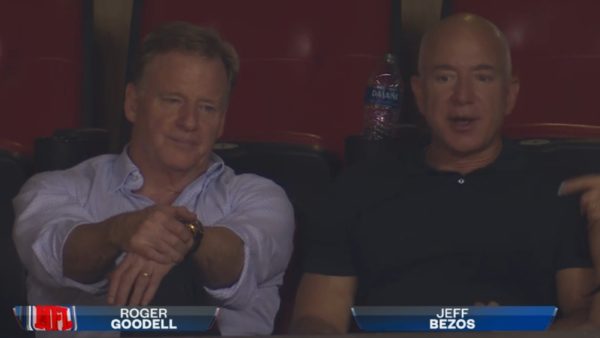 Jeff Bezos next to Roger Goodell