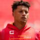 Patrick Mahomes during warmups wearing a Chiefs hoodie