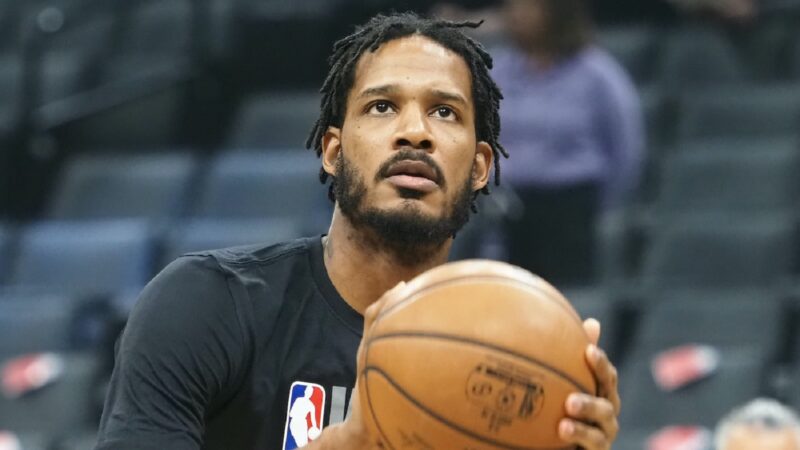 Trevor Ariza holds a ball
