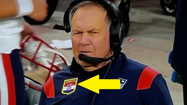 Bill Belichick with a flag on his shirt
