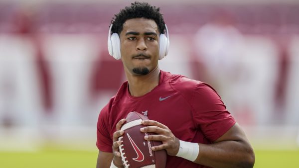 Bryce Young holds a ball