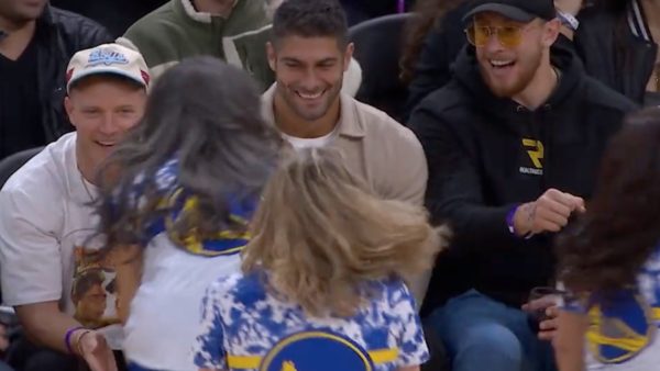 Jimmy Garoppolo is greeted by Warriors cheerleaders