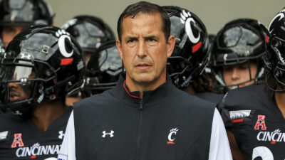 Luke Fickell leads Cincinnati onto the field