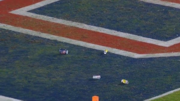 Ole Miss fans throw trash onto the field