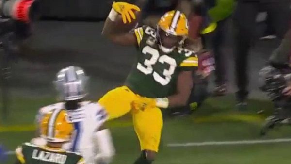 Aaron Jones grabs his groin