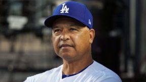 Dodgers manager Dave Roberts looking on