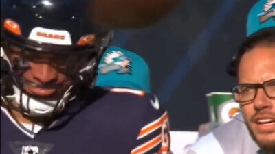 Mike McDaniel talking to Justin Fields