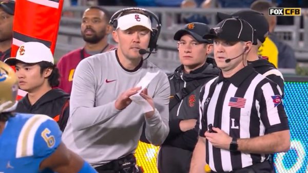 Lincoln Riley signaling for a timeout