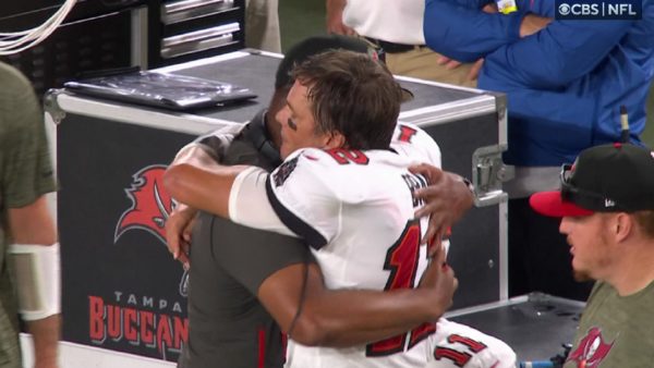 Tom Brady and Byron Leftwich hug