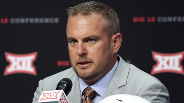 Tom Herman with the media