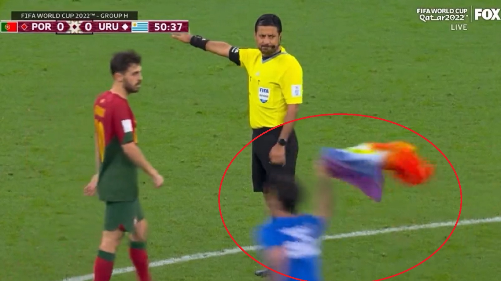 World Cup 2022 pitch invader wears 'Save Ukraine' shirt and holds pride  flag during Portugal vs Uruguay