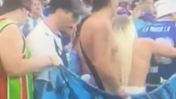 An Argentina fan celebrates topless