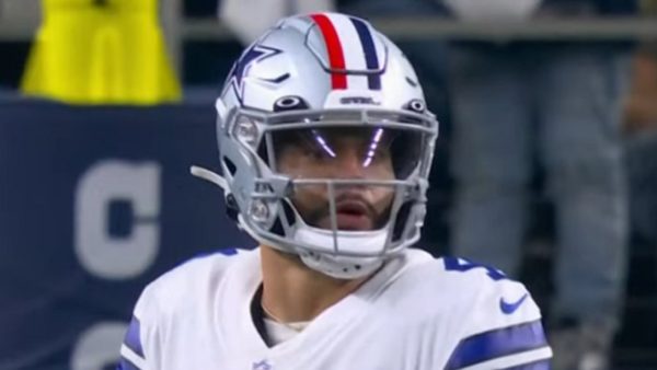 Dak Prescott wearing a helmet with a red stripe