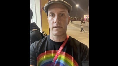 Grant Wahl in a rainbow shirt