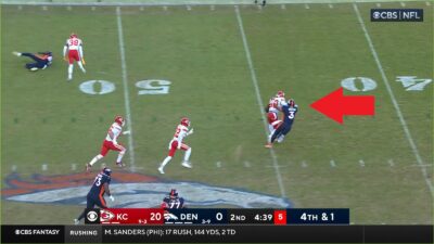 Russell Wilson gets stiff-armed