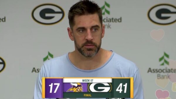 Aaron Rodgers speaks with the media