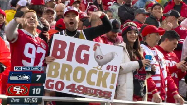 Fan holds a Big Cock Brock poster