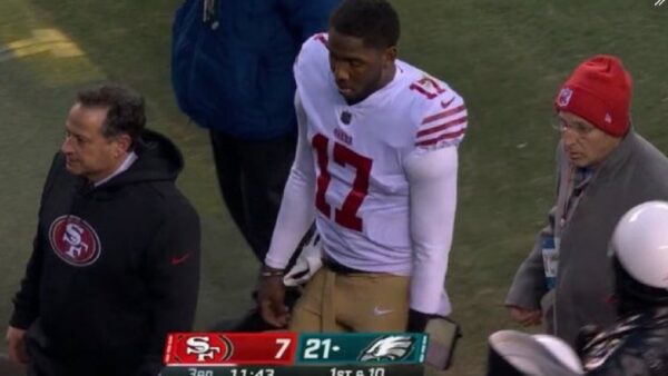 Josh Johnson holds his helmet