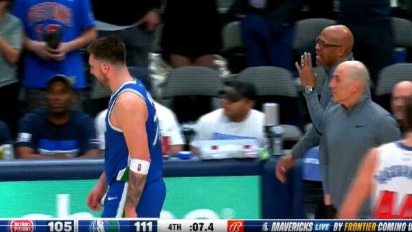 Luka Doncic being talked to by Jerome Allen