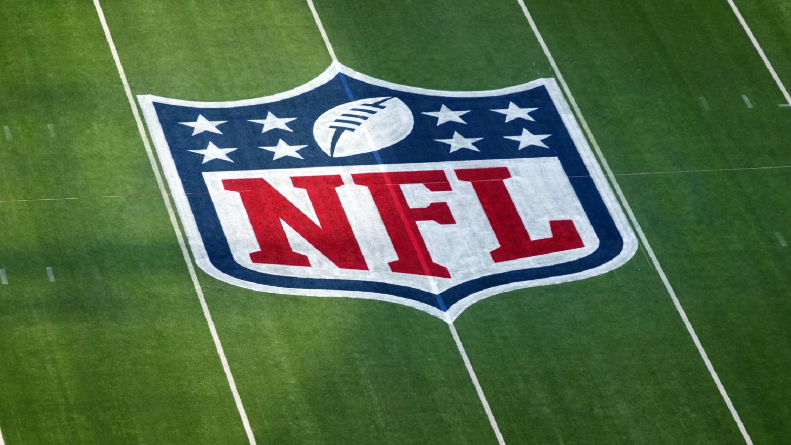 An NFL logo on the field