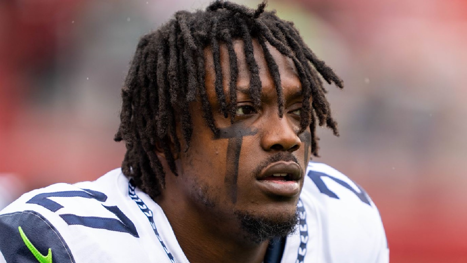 Seattle Seahawks cornerback Tariq Woolen (27) warms up before an