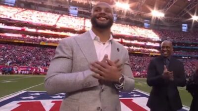 Dak Prescott with his hands over his heart