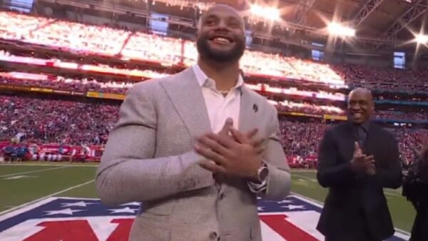 Dak Prescott with his hands over his heart