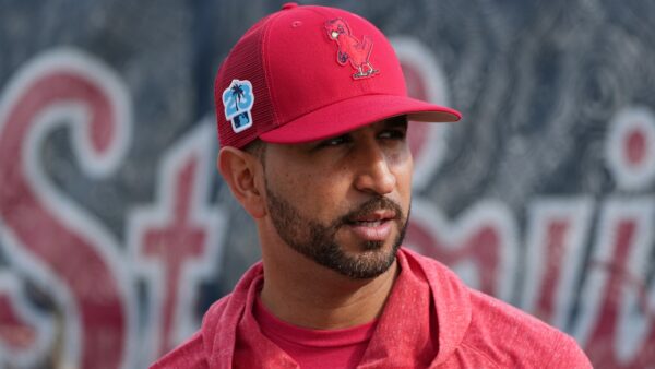 Oliver Marmol wearing a Cardinals hat