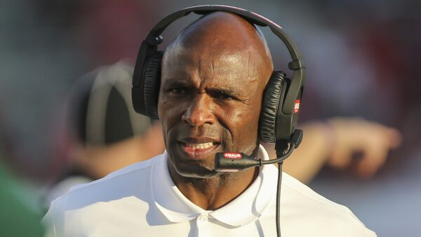 Charlie Strong wearing a headset