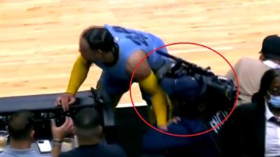 Dillon Brooks pushing a cameraman