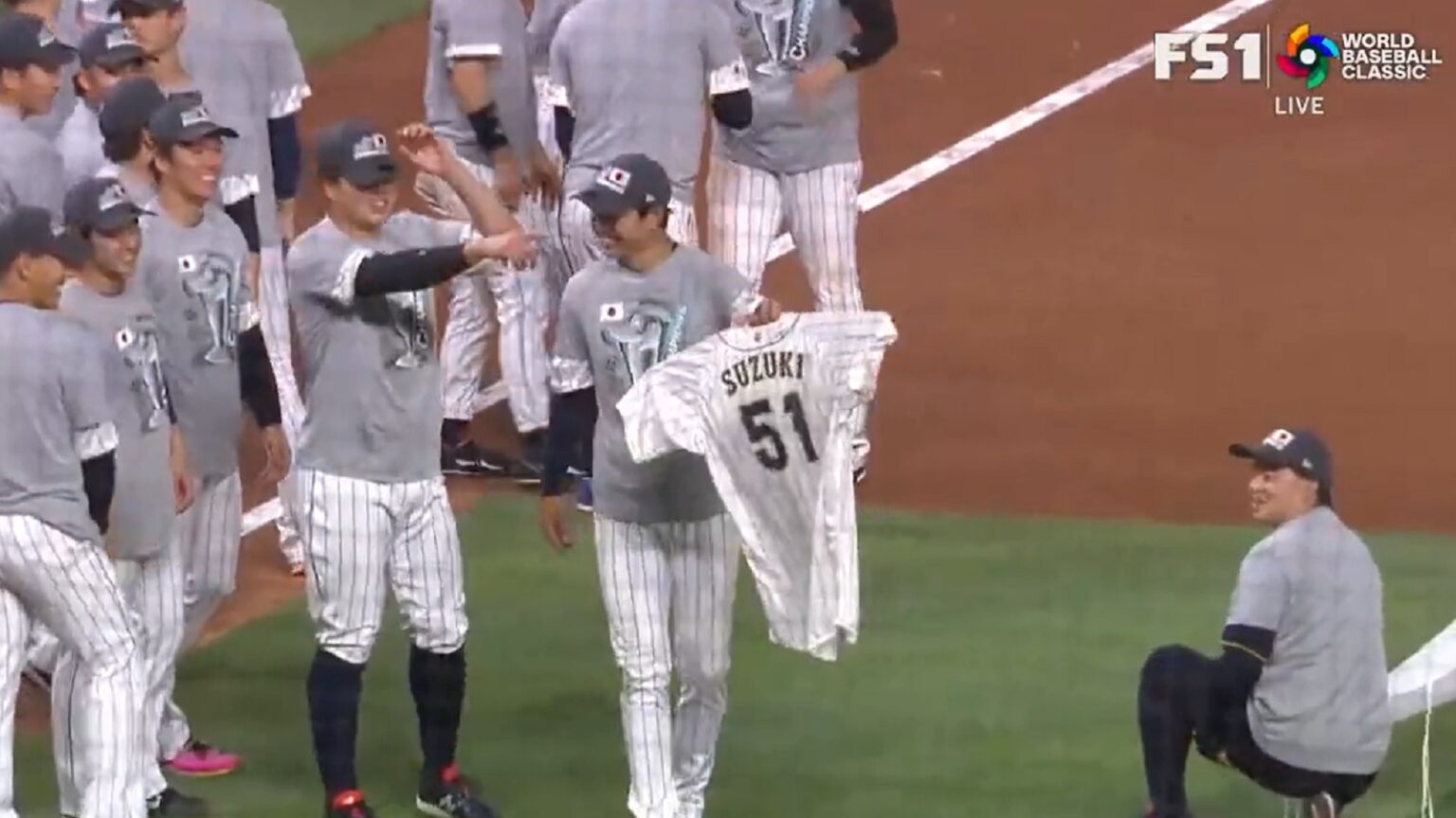 Team Japan brings out Seiya Suzuki jersey to celebrate WBC win