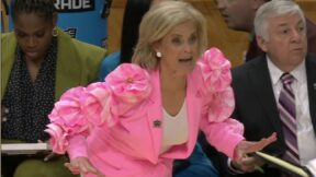 Kim Mulkey in a pink outfit
