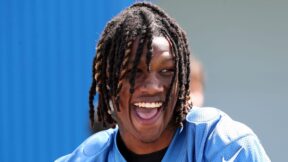 Jameson Williams smiles at practice