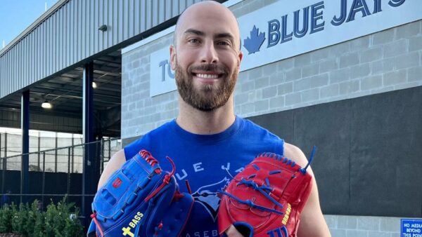 Anthony Bass holds a glove