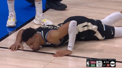Giannis Antetokounmpo on the ground