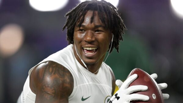 Jamaal Williams holding a football