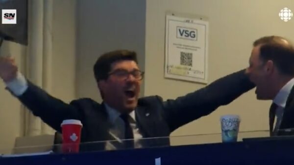 Kyle Dubas with his arms up
