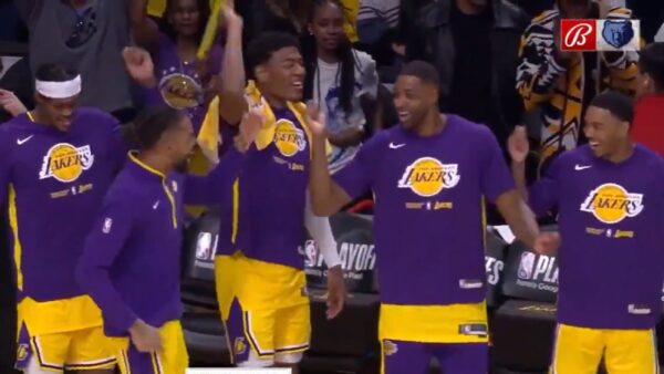 Lakers players raise their hands