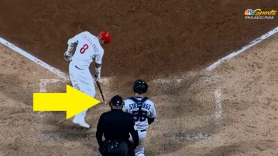 Nick Castellanos points to the ground with his bat