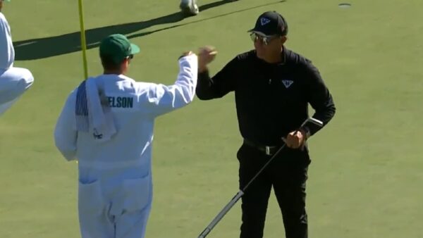 Phil Mickelson gives a high five