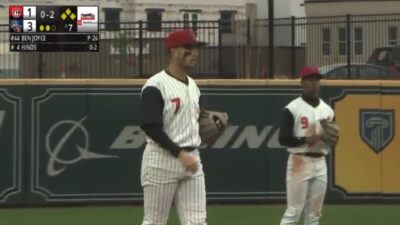 The Rocket City Trash Pandas standing on the field