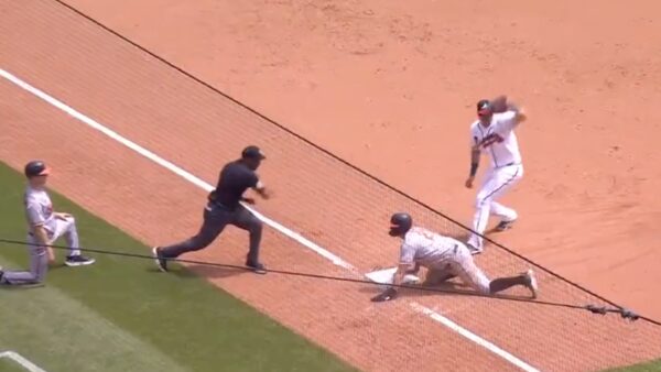 Ronald Acuna Jr throws a runner out from right field