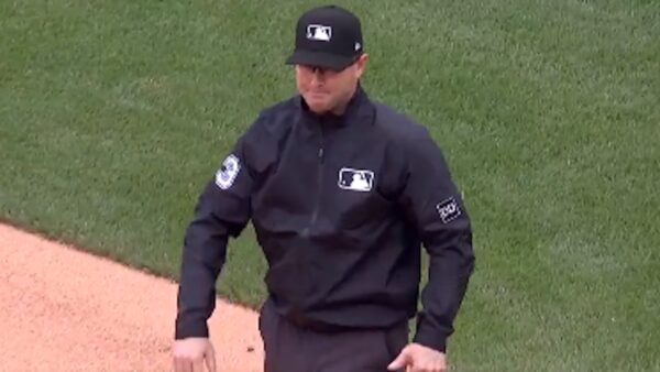 Umpire Doug Eddings at first base