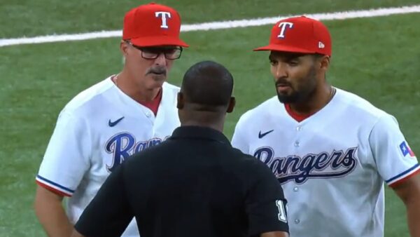 Rangers talk with the umpire