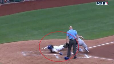 Bobby Witt Jr dives into home plate