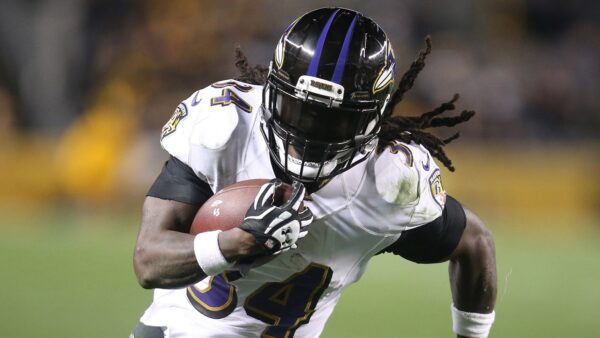 Alex Collins holding the ball