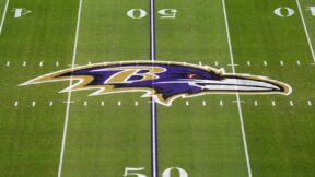 The Baltimore Ravens logo at midfield