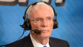 Hubie Brown wearing a headset