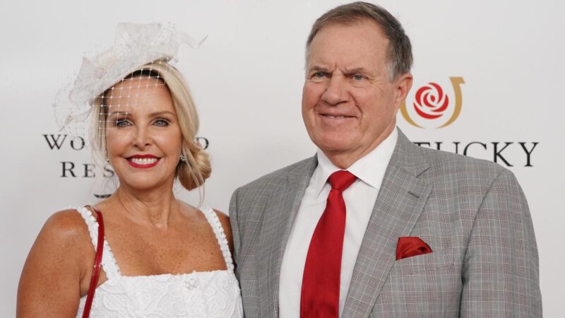 Bill Belichick poses with Linda Holliday