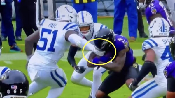 A Ravens player has his facemask grabbed